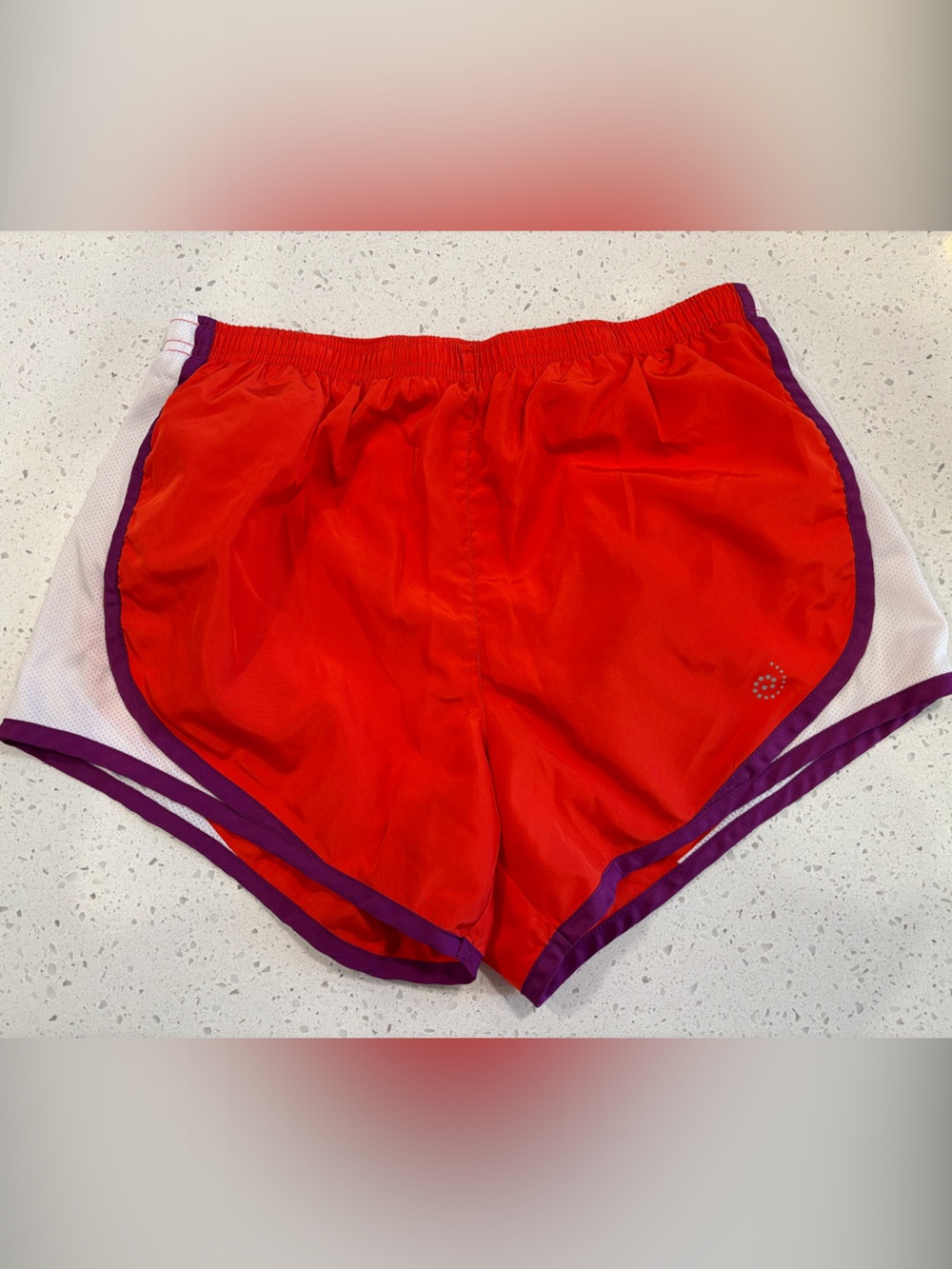 Women’s Orange-Red Athletic Running Shorts with Purple Trim
